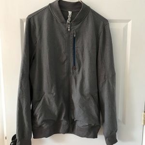 Lululemon running jacket has blue zipper on front pocket